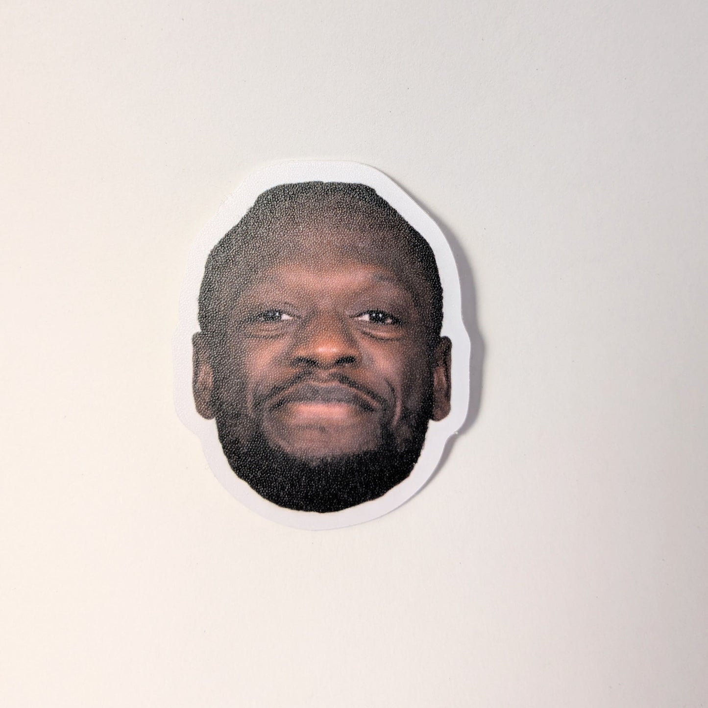 Cutout of a person's face on a white background