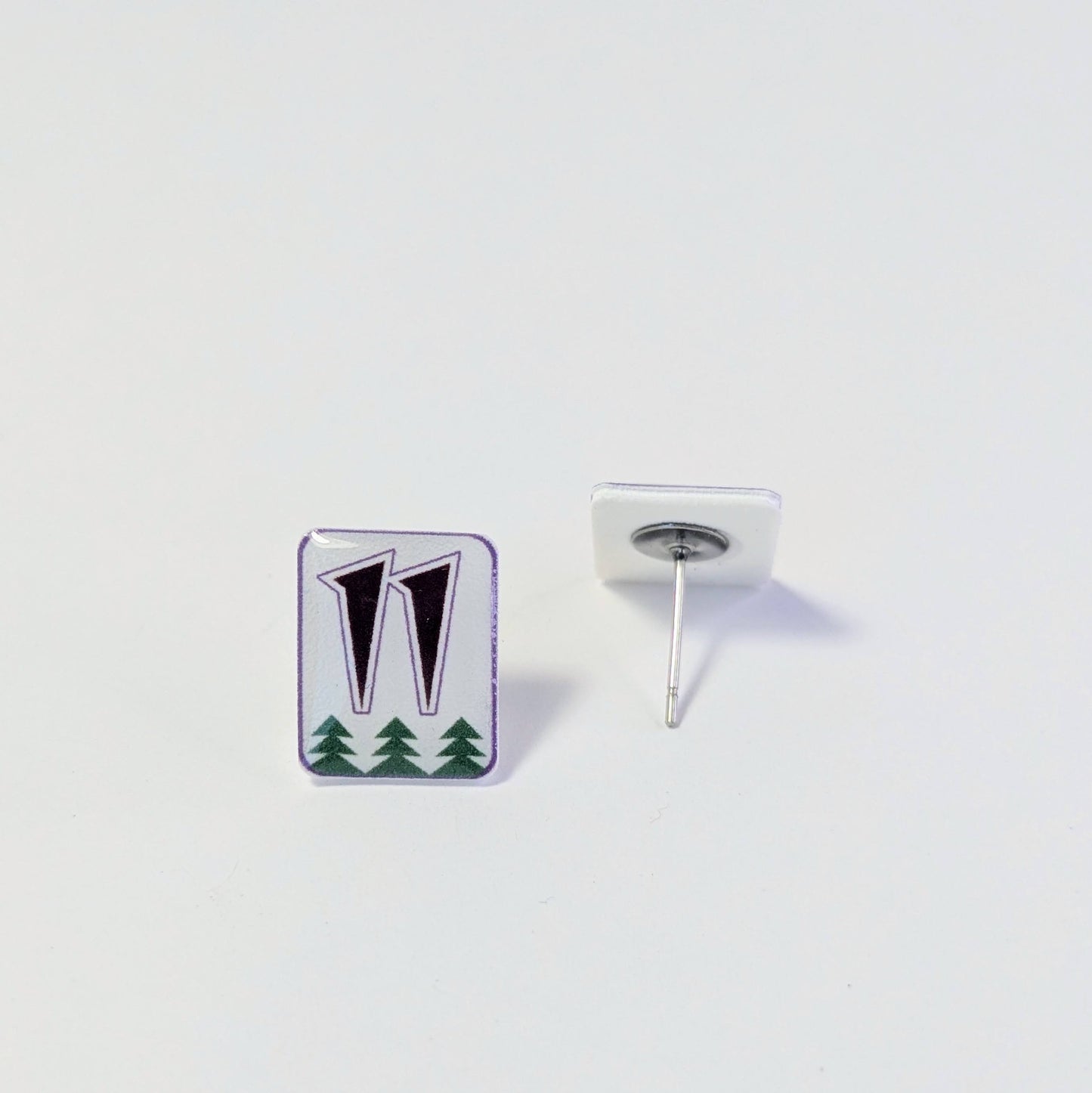 Pair of earrings with number 11 on a small white rectangle. 