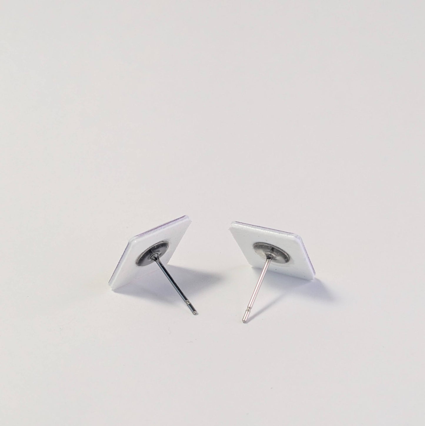 Pair of earrings on a light gray background