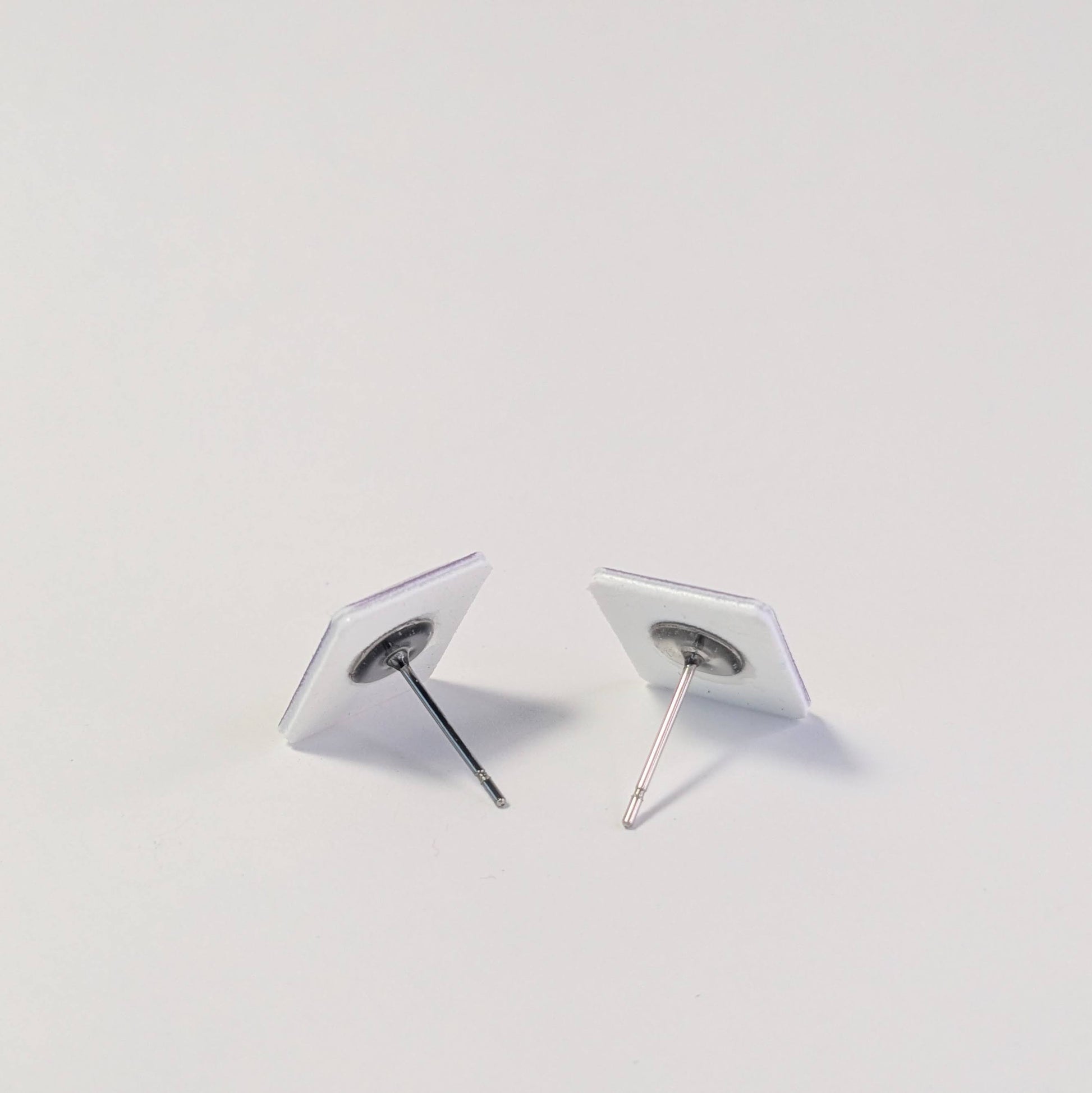 Pair of earrings on a light gray background