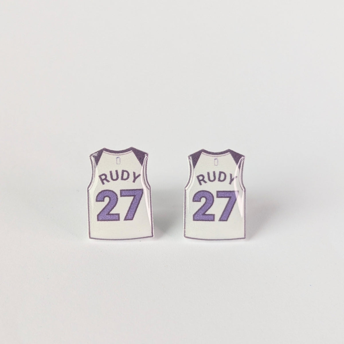 Basketball jerseys with 'Rudy' and number '27' on a light gray background