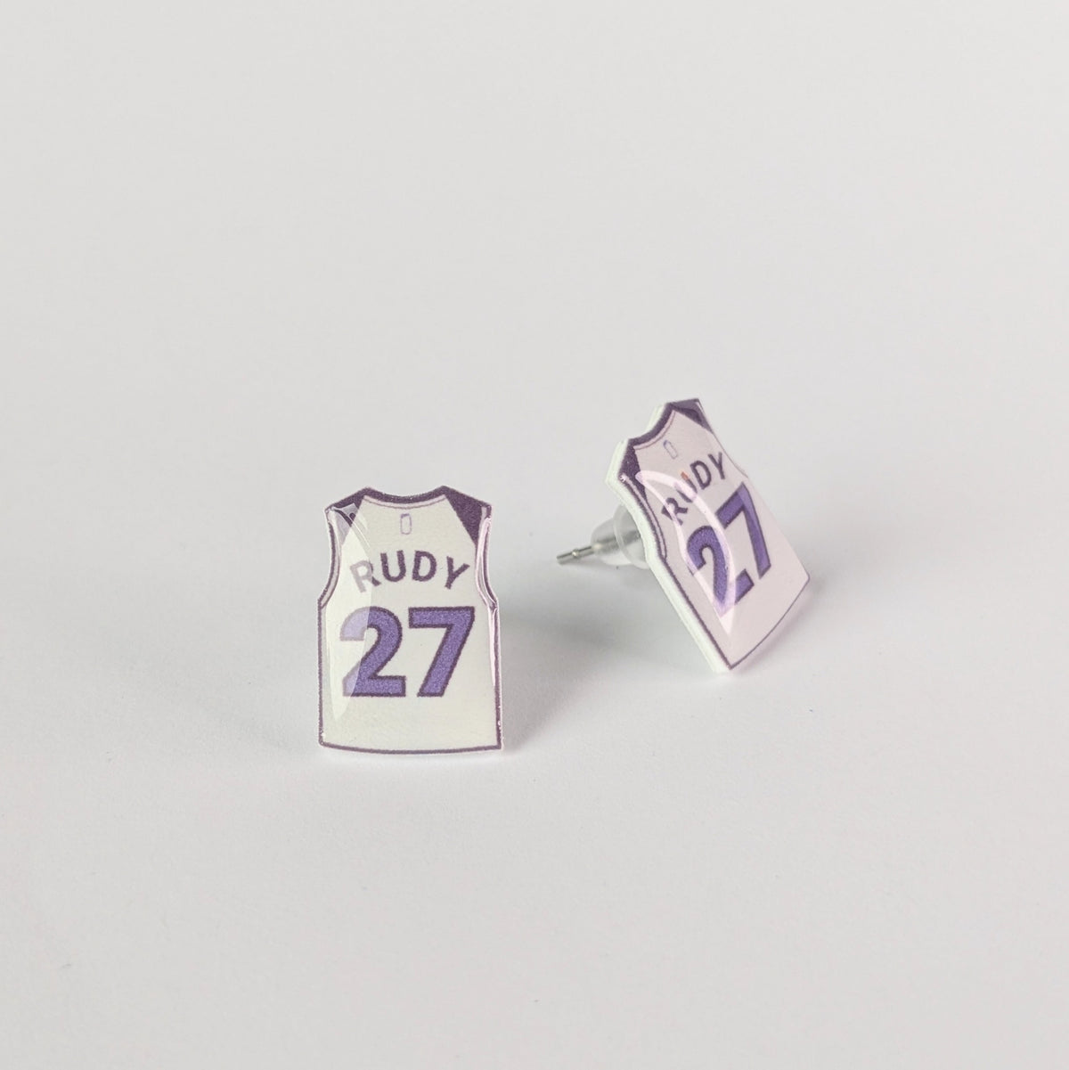 Basketball jersey earrings with 'Rudy' and number '27' on a light gray background