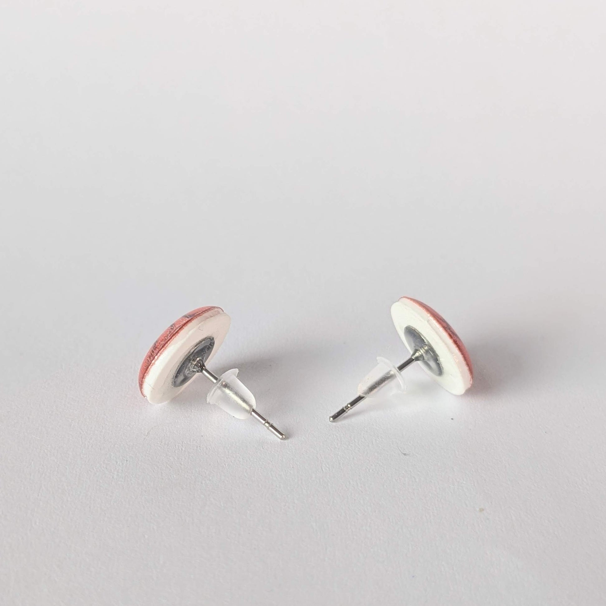 Pair of earrings on a light gray background