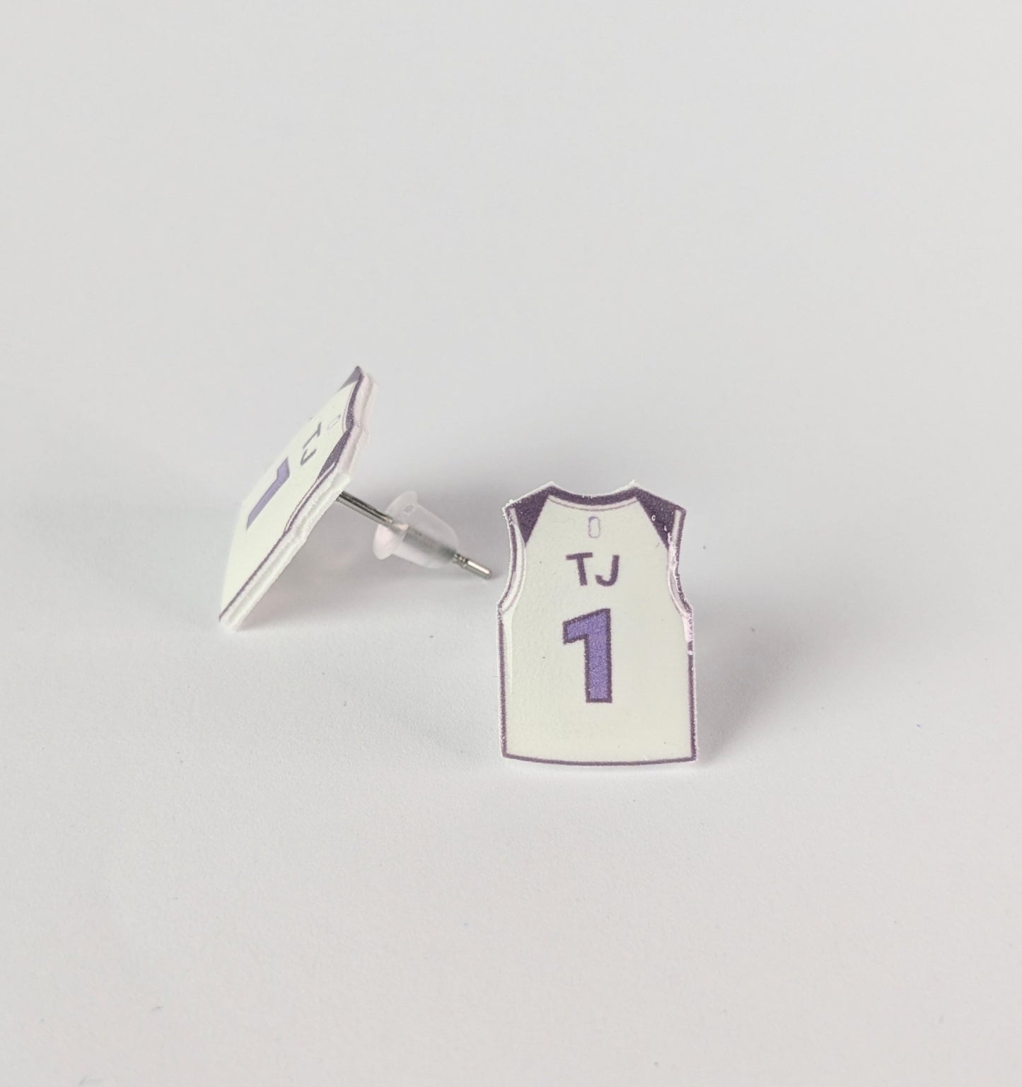Basketball jersey earrings with 'TJ' and number '1' on a gray background