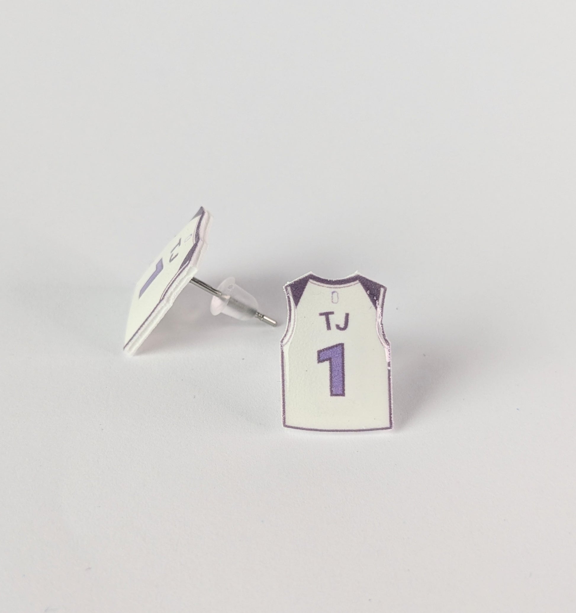 Basketball jersey earrings with 'TJ' and number '1' on a gray background