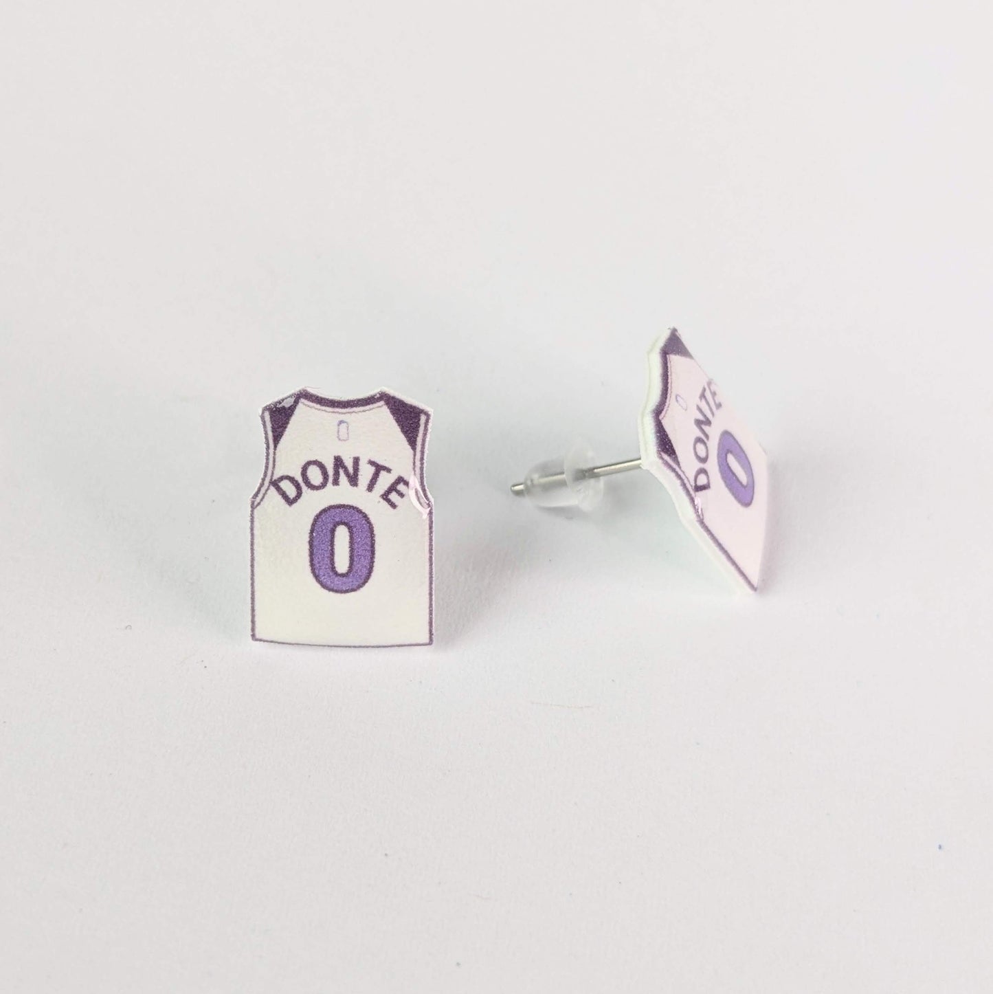 Earrings shaped like miniature basketball jerseys with 'Donte' and number '0' on a white background