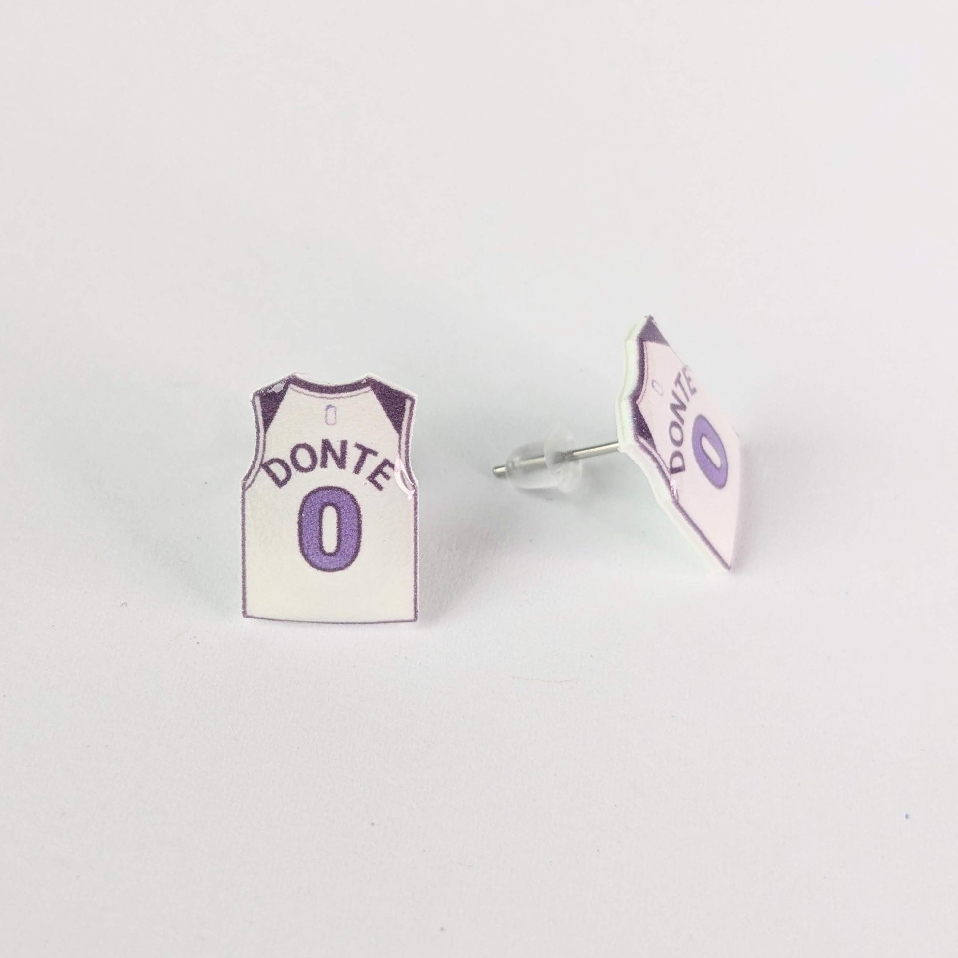 Earrings shaped like miniature basketball jerseys with 'Donte' and number '0' on a white background