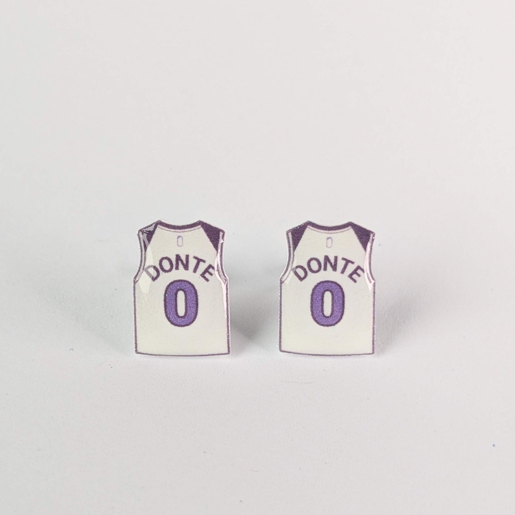Two miniature basketball jersey earrings with 'Donte' and number '0' on a light gray background