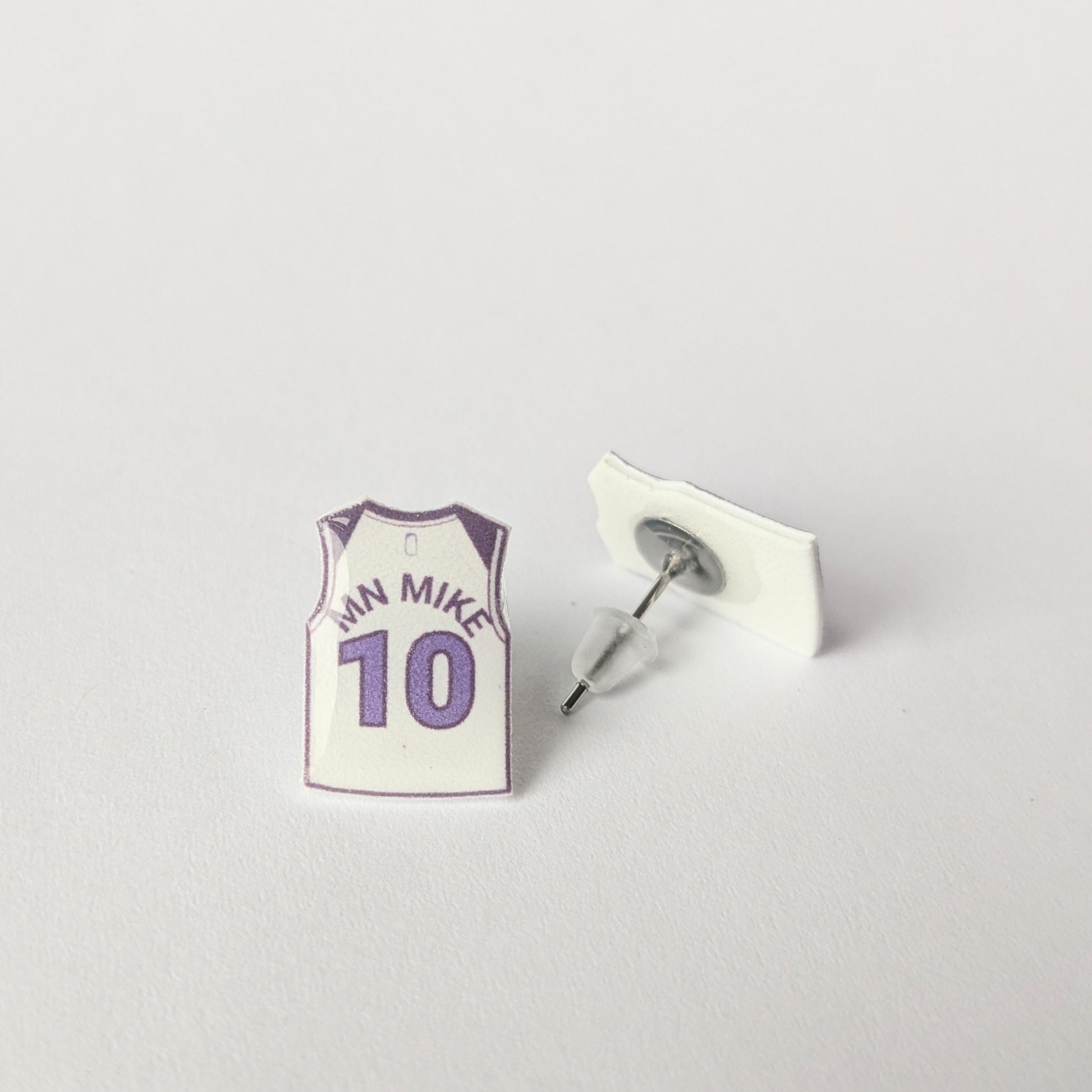 Basketball jersey earring with 'MN MIKE 10' text on a light gray background