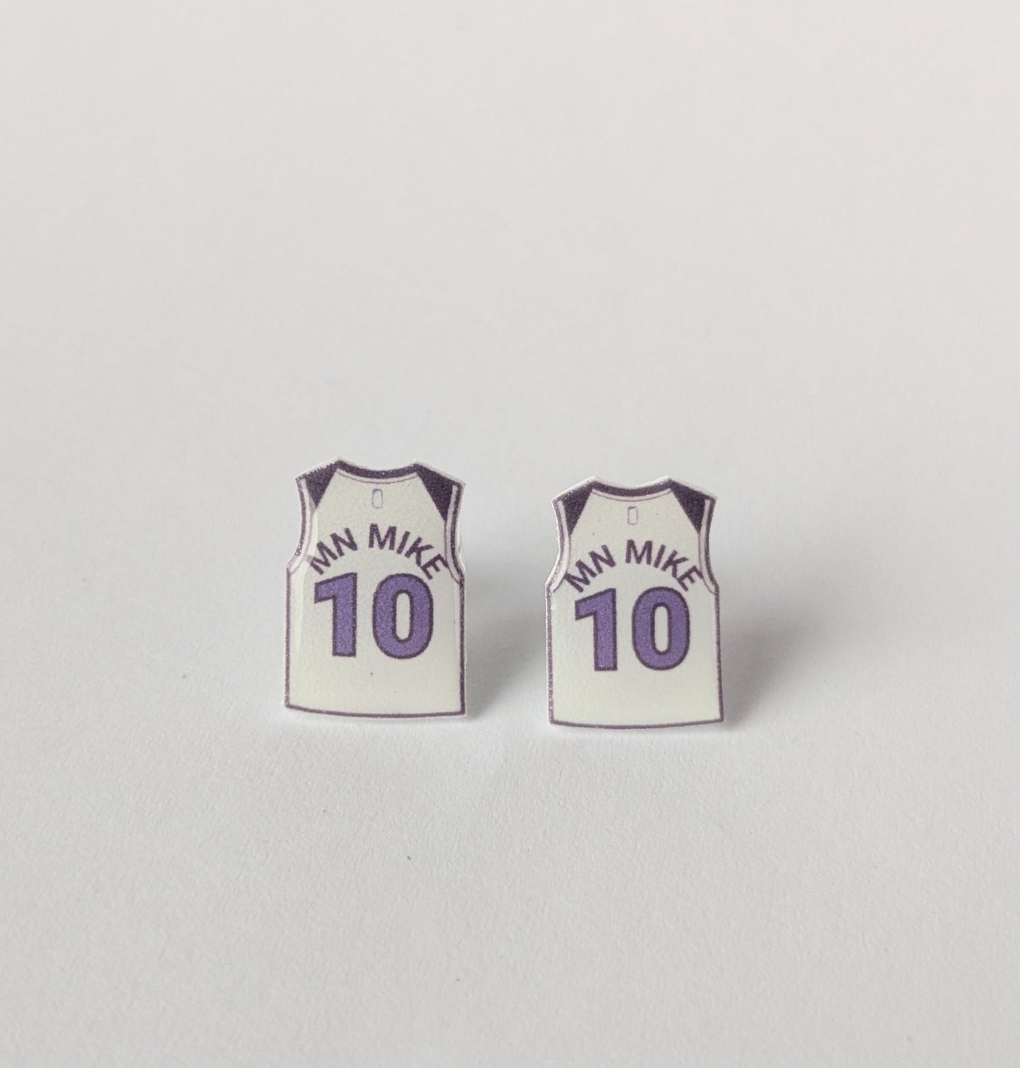 Basketball jersey earrings with 'MN MIKE' and number '10' on a light gray background