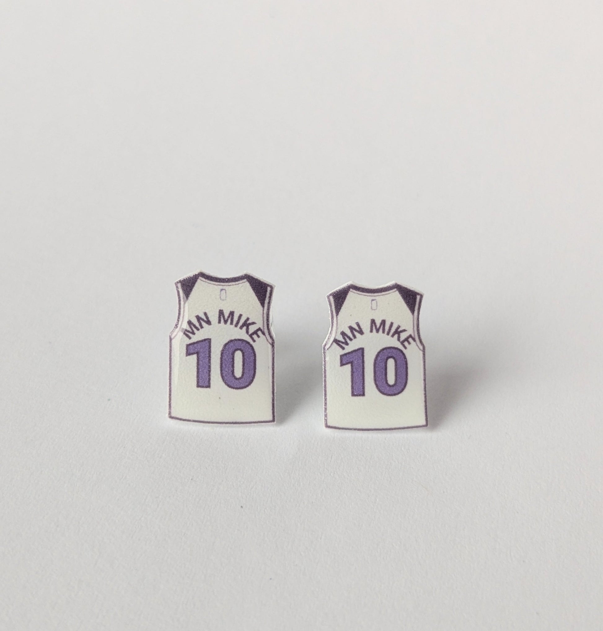 Basketball jersey earrings with 'MN MIKE' and number '10' on a light gray background