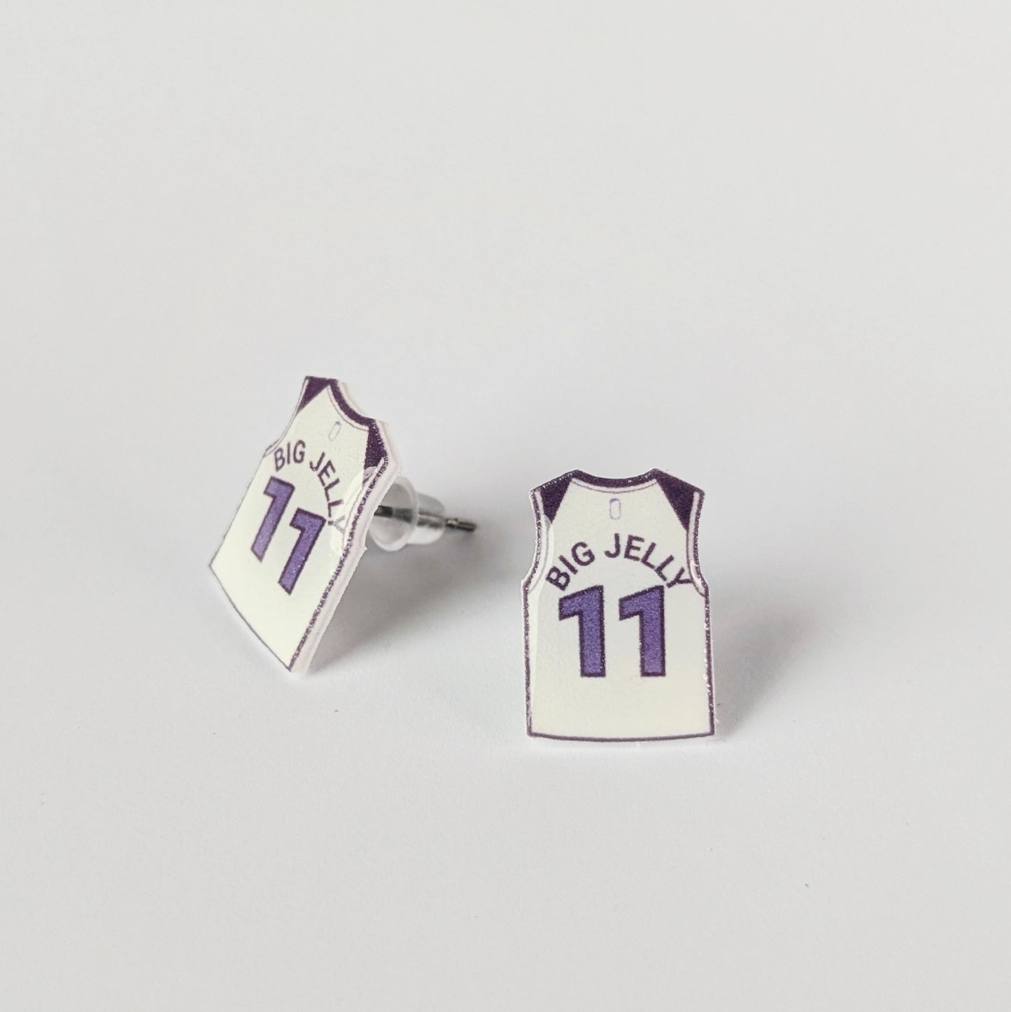 Basketball jersey earrings with 'BIG JELLY' and number '11' on a light gray background