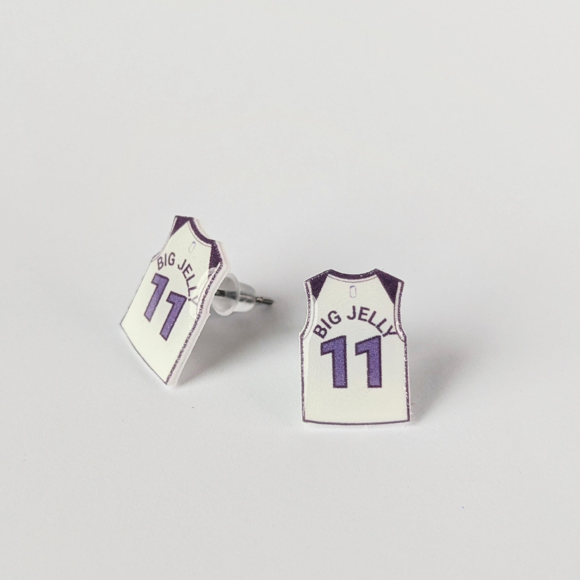 Basketball jersey earrings with 'BIG JELLY' and number '11' on a light gray background