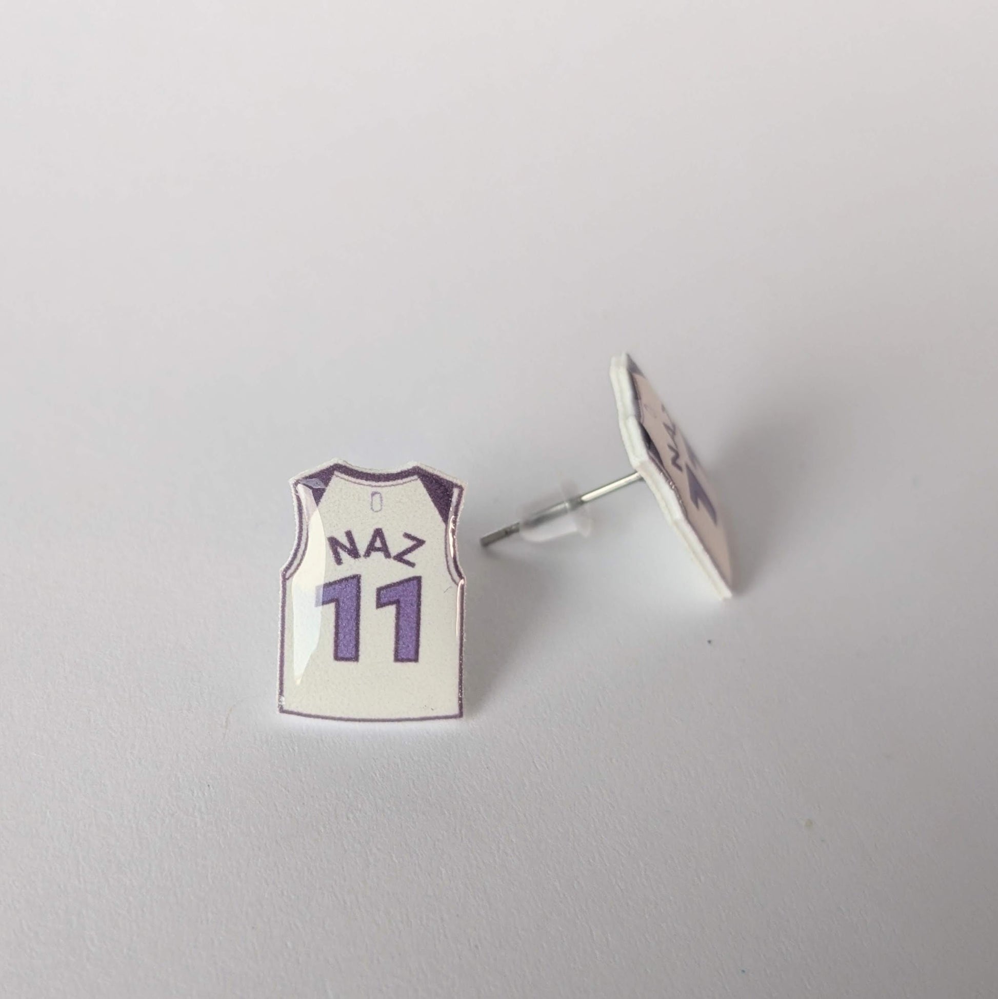 Earring with a basketball jersey design on a gray background