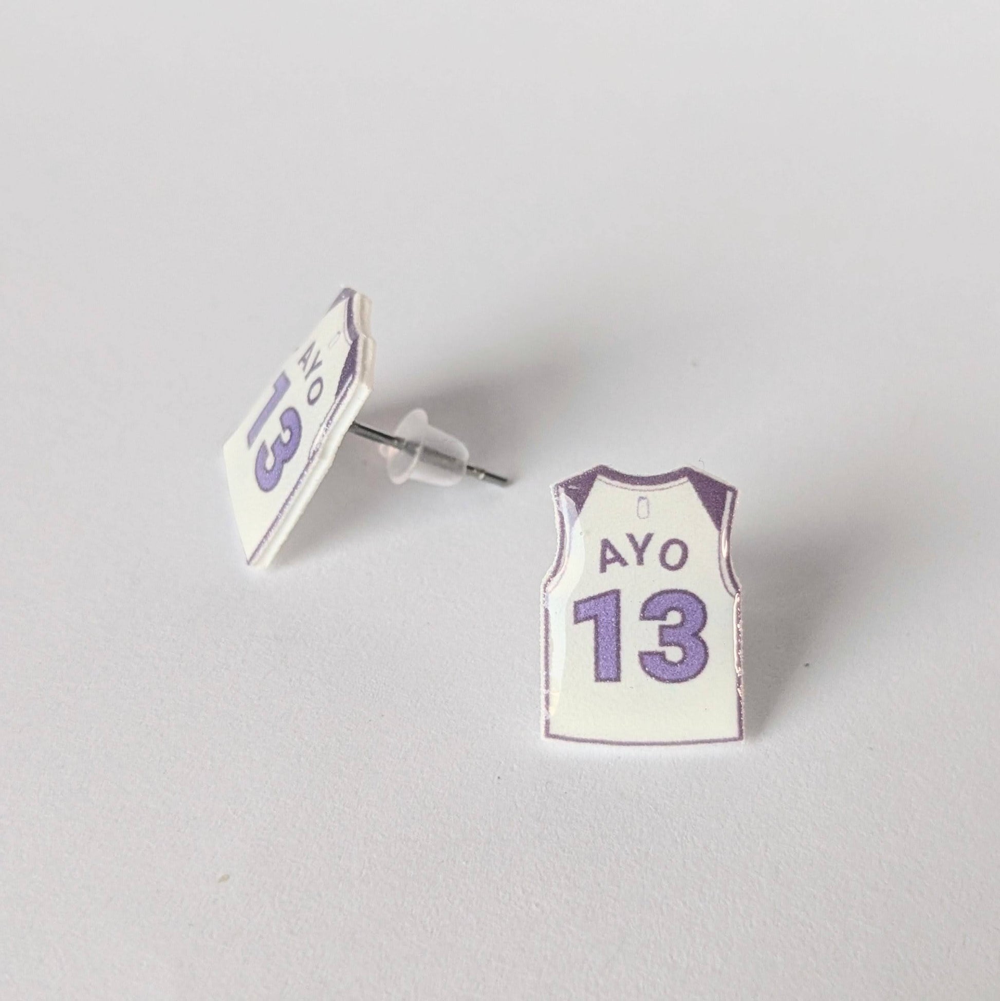 Basketball jersey earrings with 'Ayo' and number '13' on a light gray background