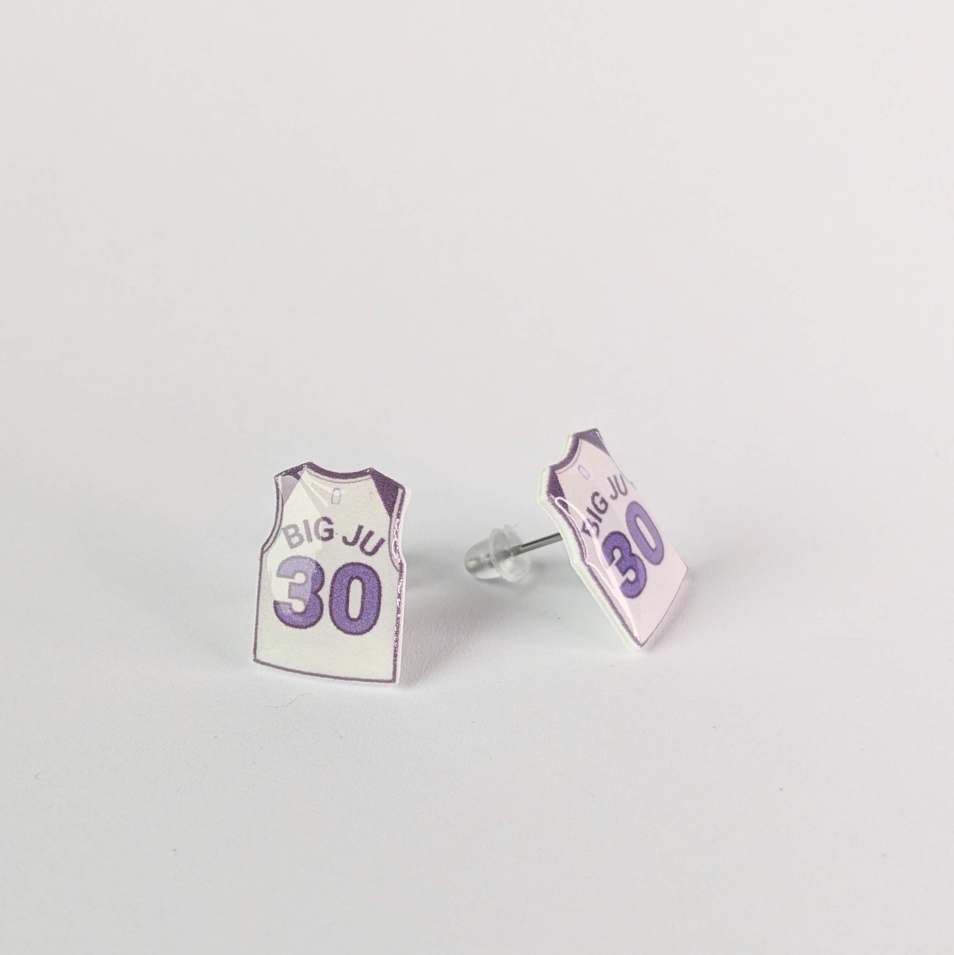 Earrings shaped like miniature sports jerseys with 'BIG JU' and number '30' on a light gray background