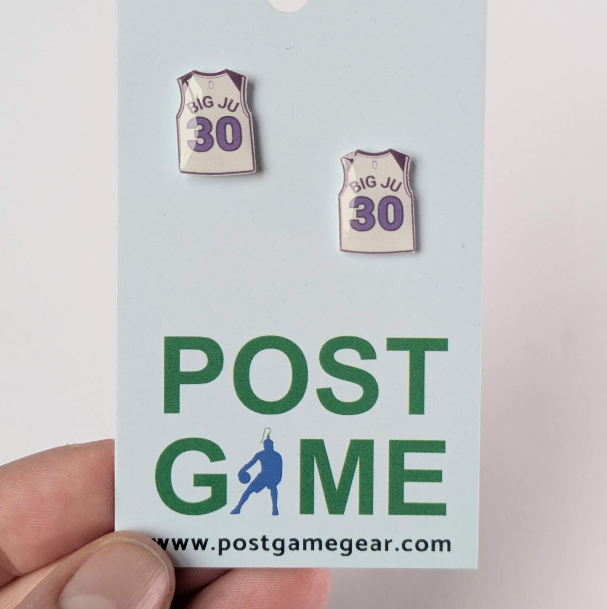 Basketball jersey earrings on a 'POST GAME' card .
