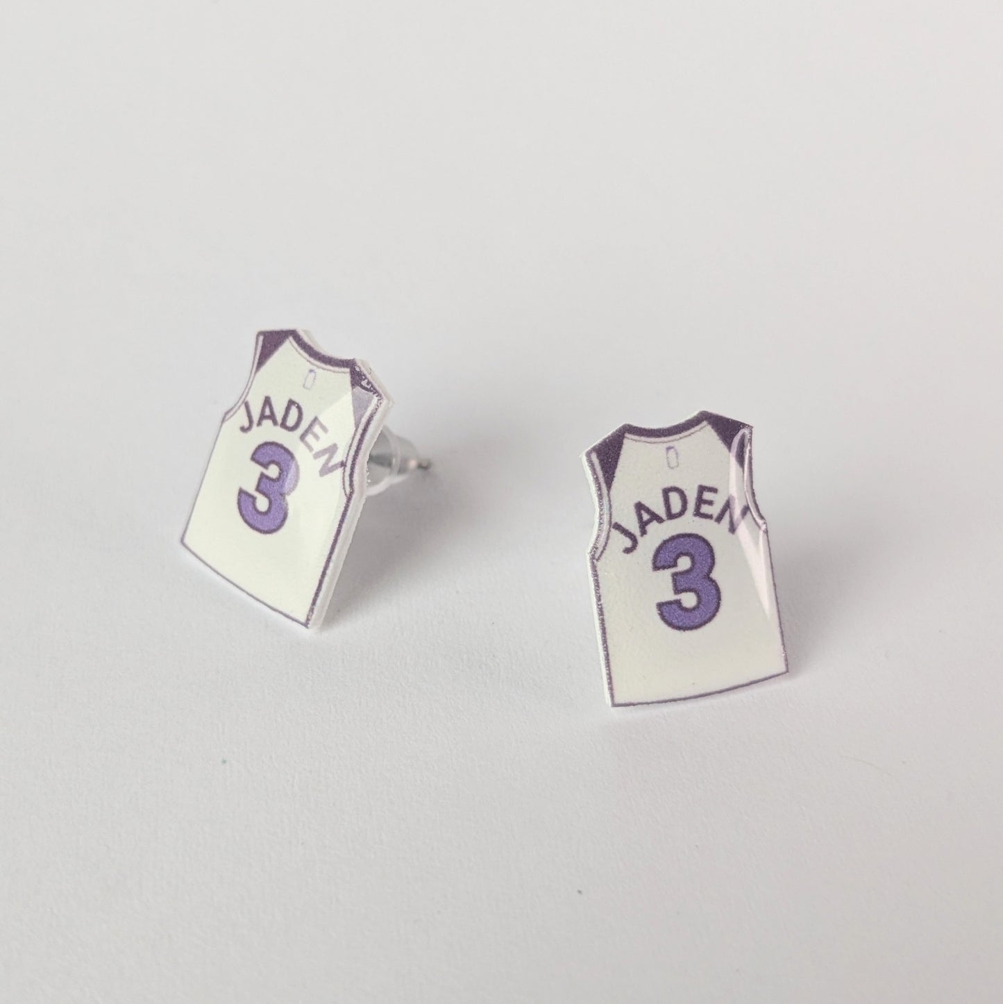 Basketball jersey earrings with 'Jaden' and number '3' on a light gray background