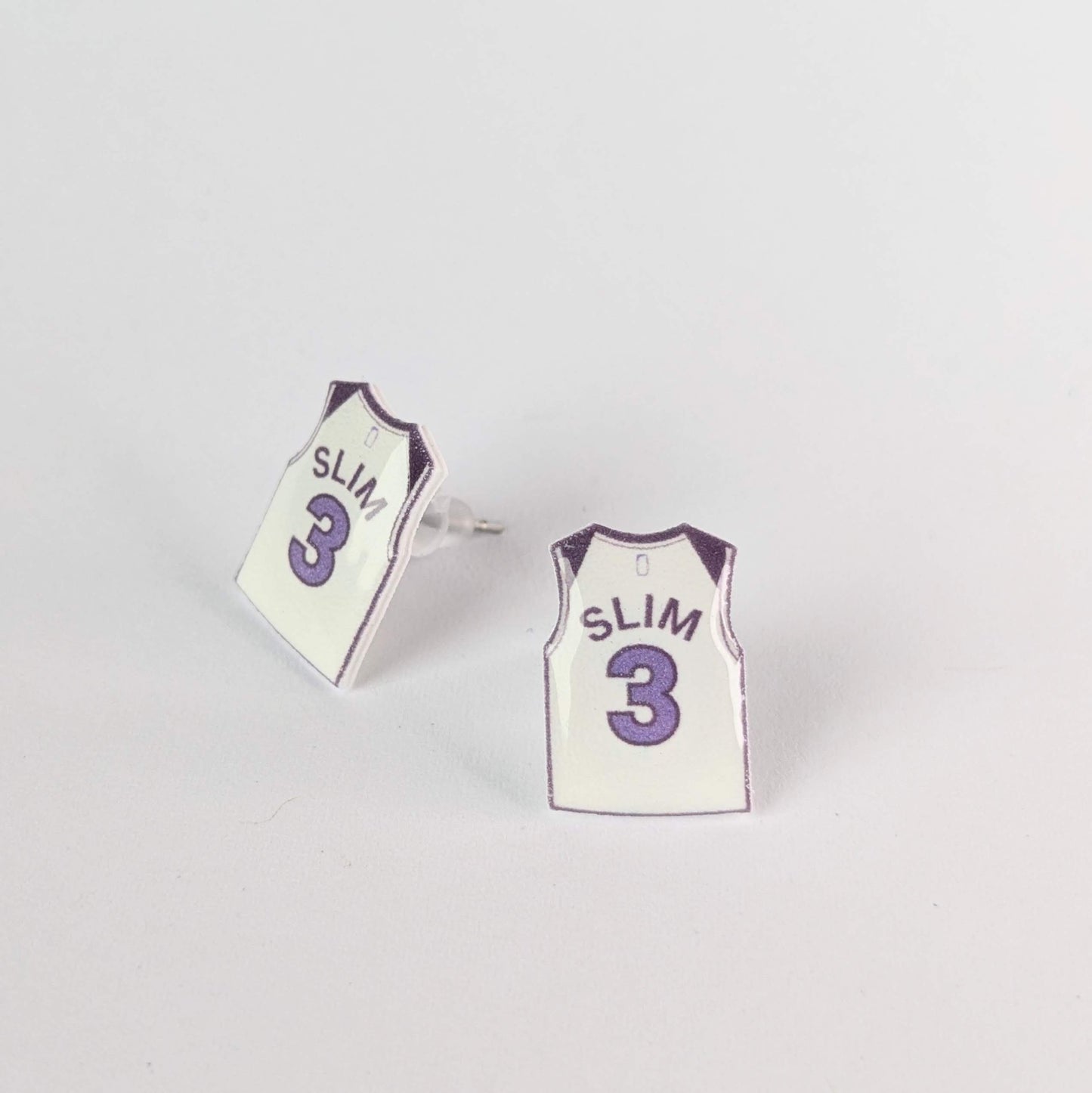 Basketball jersey earrings with 'SLIM' and number '3' on a light gray background