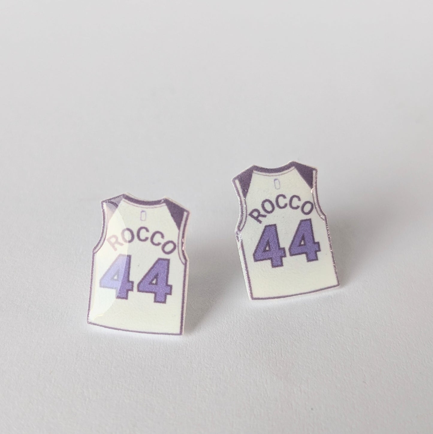 Basketball jersey earrings with 'Rocco' and number '44' on a light gray background