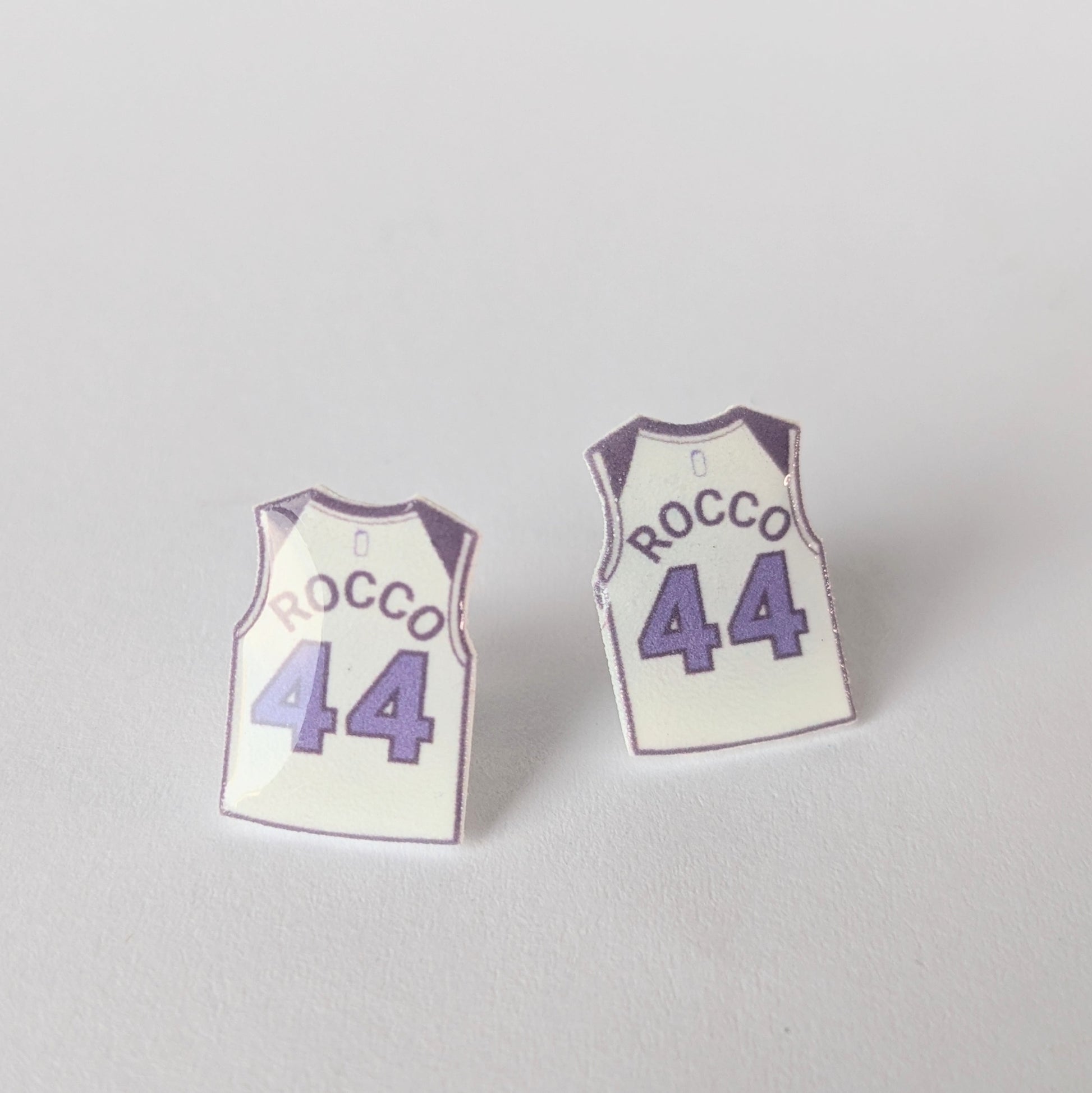 Basketball jersey earrings with 'Rocco' and number '44' on a light gray background