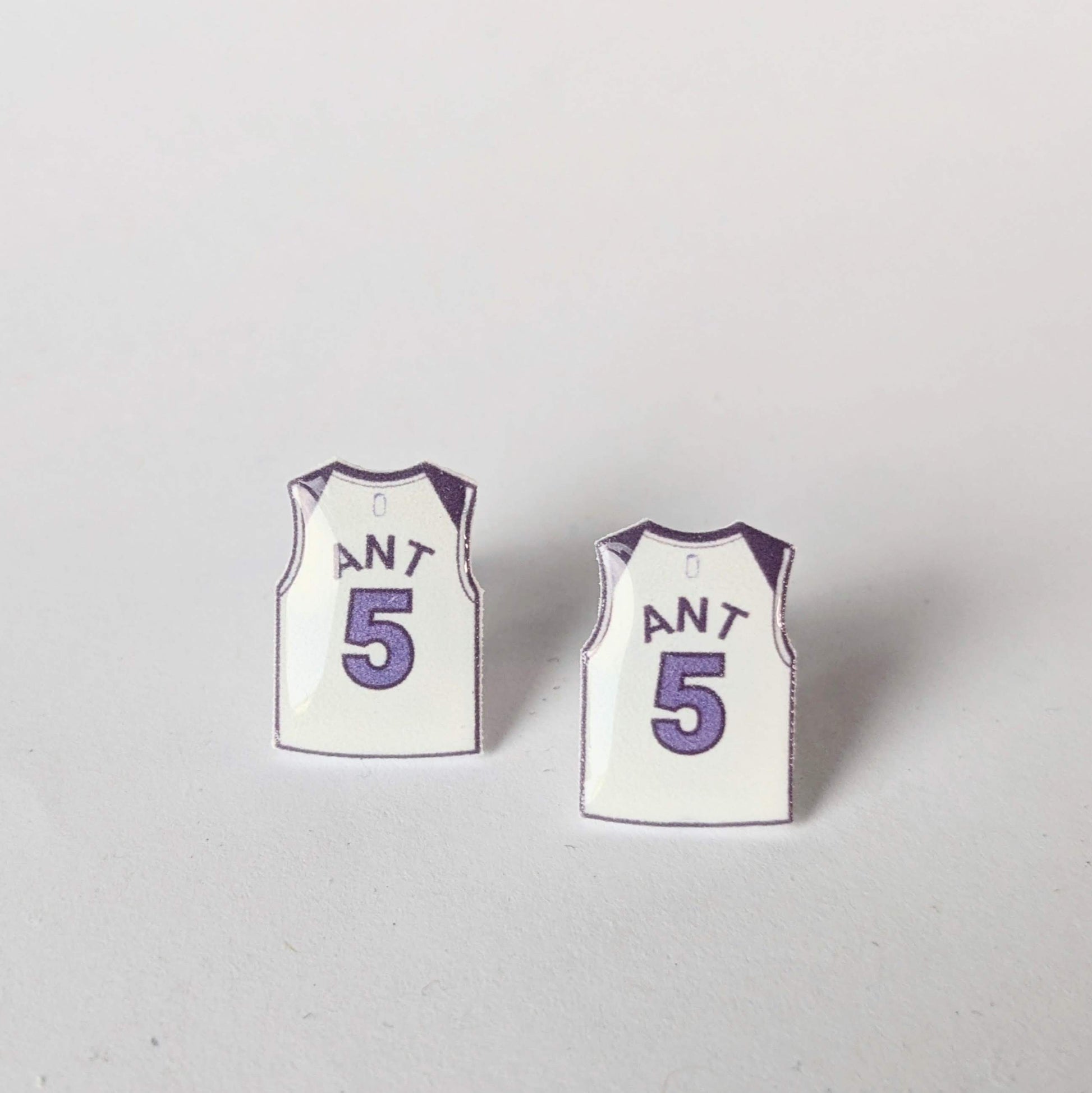 Two miniature basketball jersey earrings with the number 5 and the name 'ANT' on a light gray background.