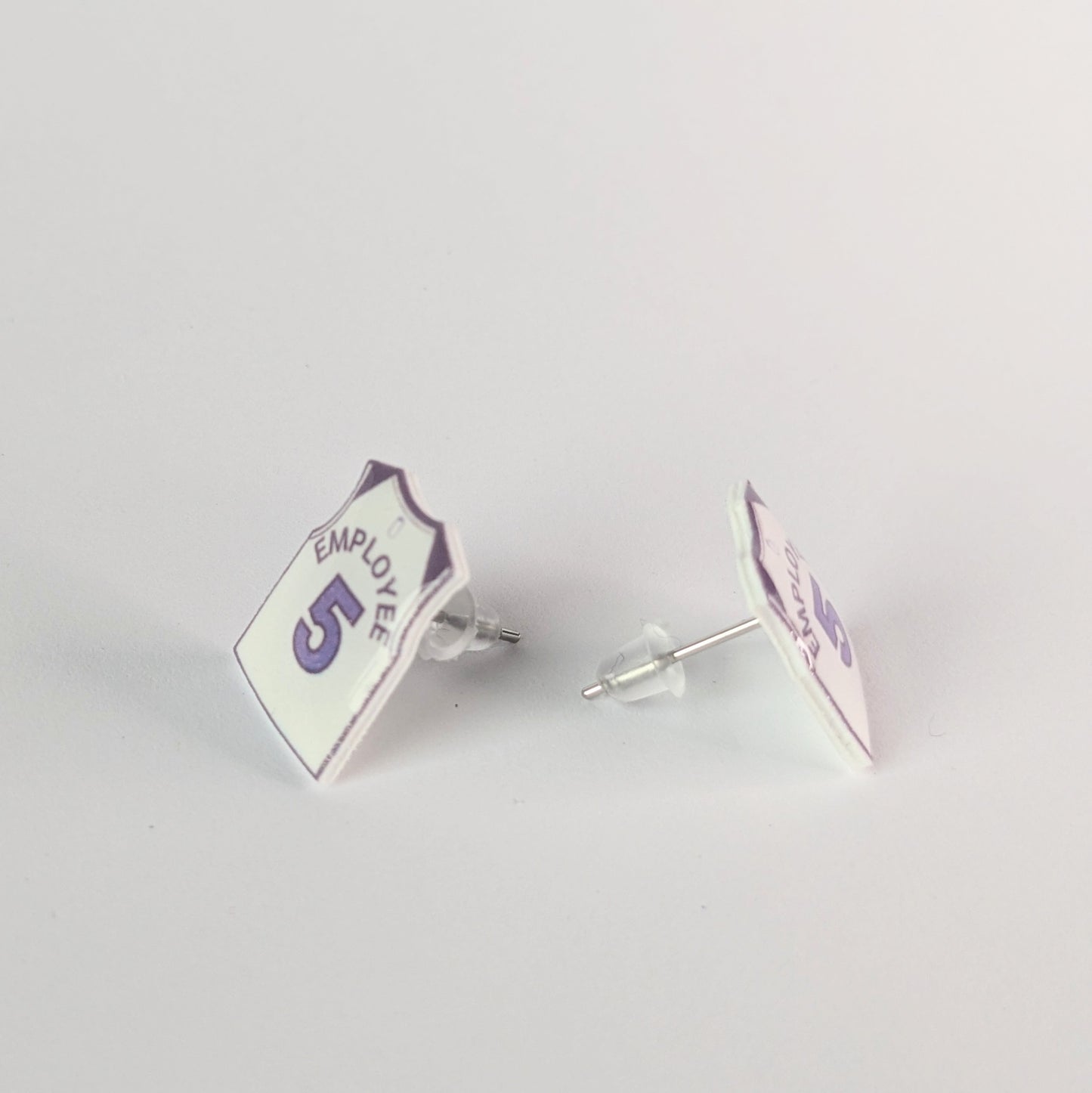 Pair of earrings with 'Employee 5' design on a light gray background